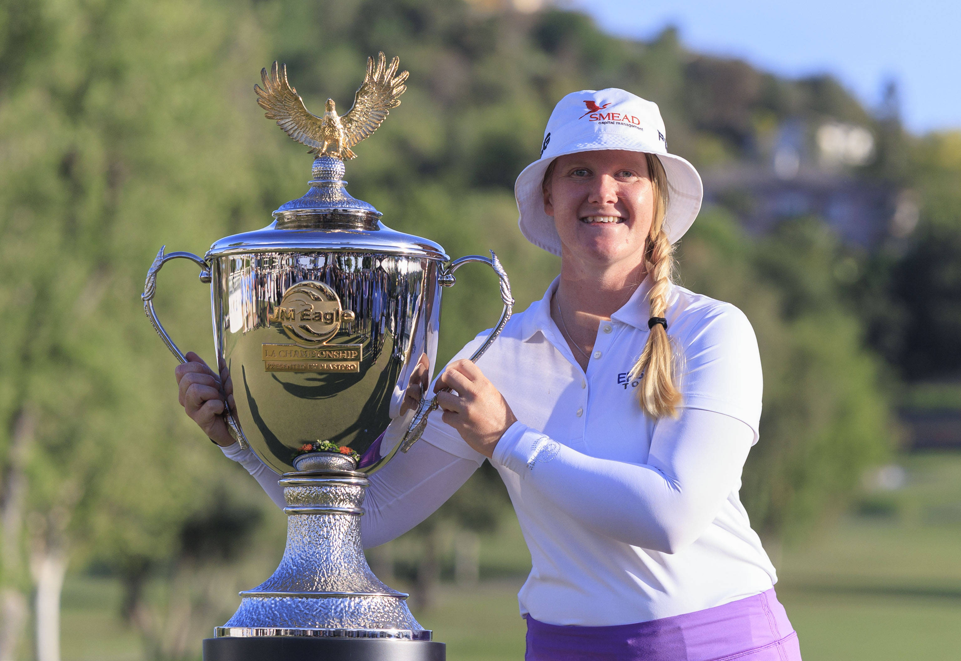 Ingrid Lindblad beside JM Eagle Trophy